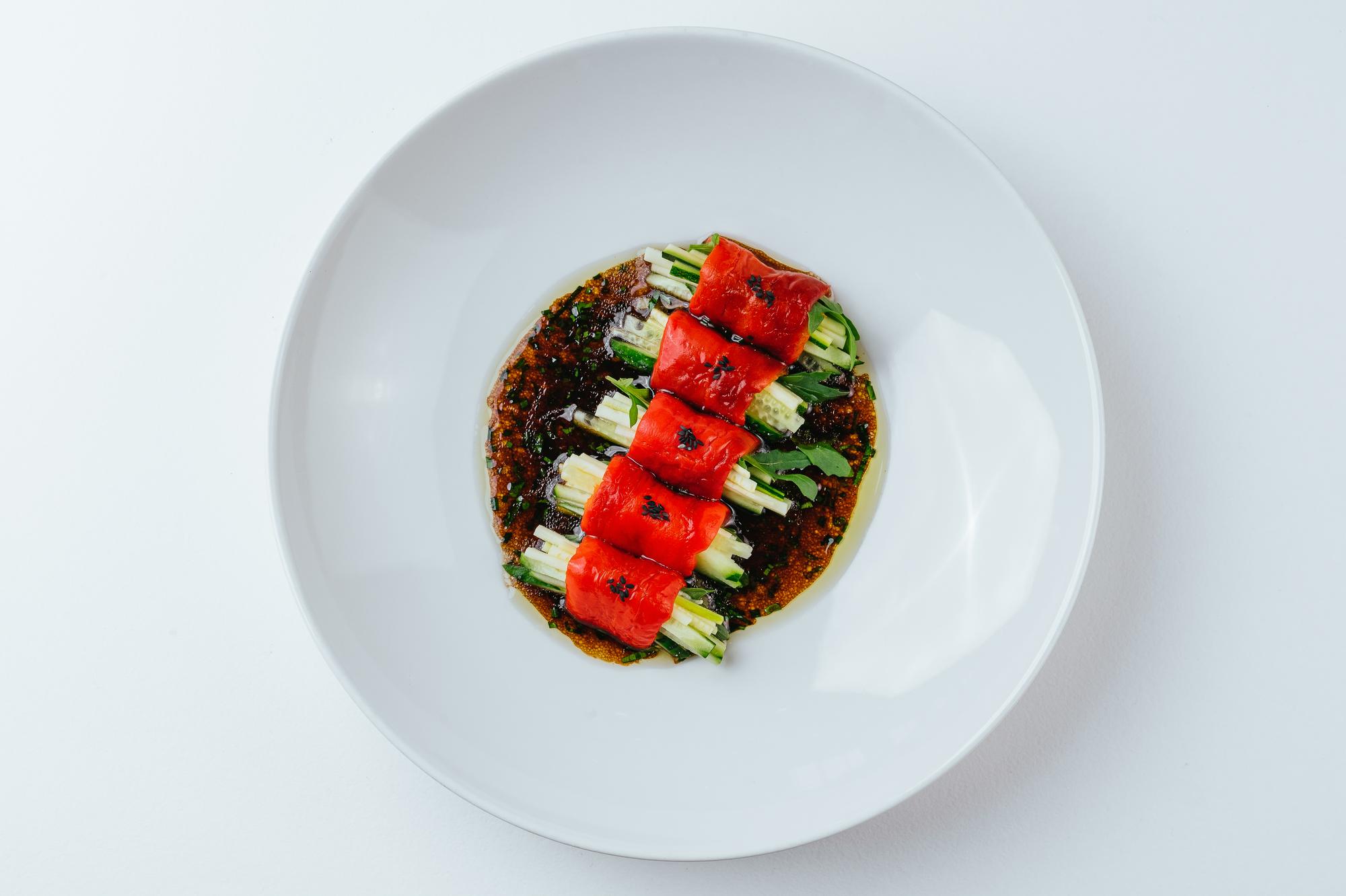 Plated dish photographed from above on dark surface